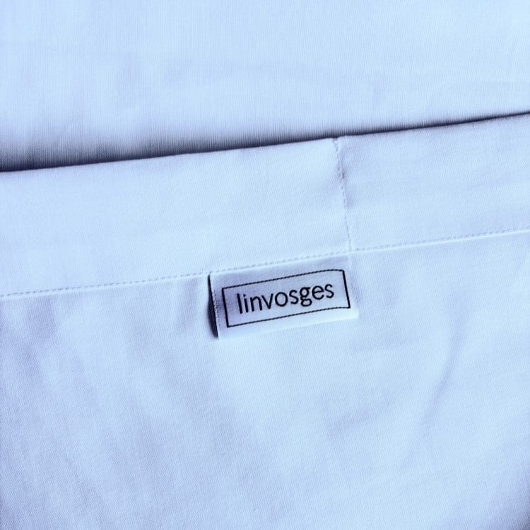 Finition vignette et puce RFID drap EDEN - HOTEL BLANCHISSEUR PROFESSIONNEL - Linvosges Hôtellerie